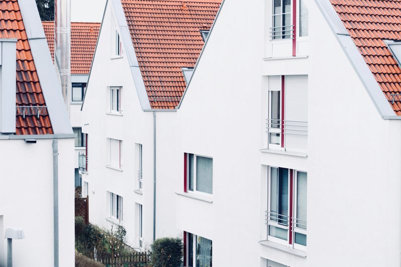 White houses with red roofs create a clean and modern suburban landscape